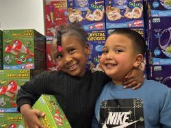 Ellis Early Learning students pose with a large donation of educational toys from Amazon for use in Ellis's STEM Exploration Labs. Photo courtesy of Ellis Early Learning.